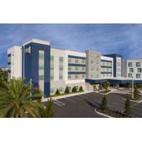 Home2 Suites by Hilton Orlando Southeast Nona Logo