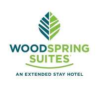 WoodSpring Suites Chicago Romeoville Logo