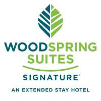 WoodSpring Suites Austin South Central I-35 Logo