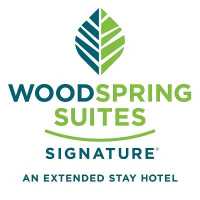 WoodSpring Suites Las Colinas - Northwest Dallas Logo