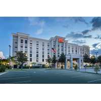 Hampton Inn & Suites Orlando Intl Dr N Logo
