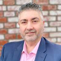 Shawn Haghighi at Pacific Wholesale Mortgage Logo