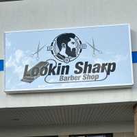 Lookin Sharp Barber Shop Logo