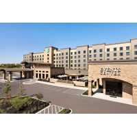 Embassy Suites by Hilton San Antonio Brooks Hotel & Spa Logo