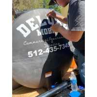 Deluxe Mobile Commercial Powerwashing and Detailing LLC Logo