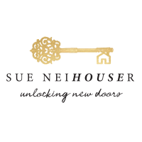 Sue Neihouser - RE/MAX Traders Unlimited Logo