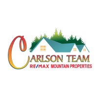 RE/MAX Mountain Properties Logo