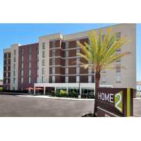 Home2 Suites by Hilton Orlando Near Universal Logo