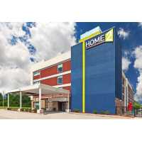Home2 Suites by Hilton Gonzales Logo
