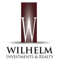 Wilhelm Investments & Realty Logo