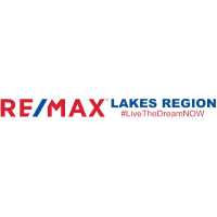 RE/MAX LAKES REGION REAL ESTATE Logo
