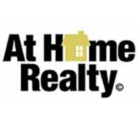 Christopher Orange - At Home Realty Logo