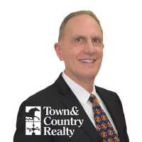 Town & Country Realty, Inc. Mike Montpetit Logo